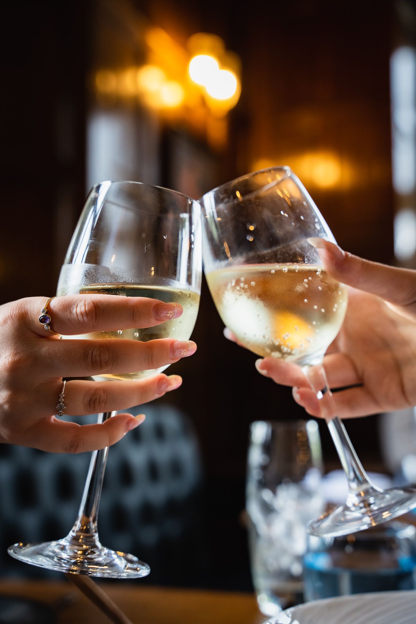 Valentine's dinner | Two glasses clinking in celebration
