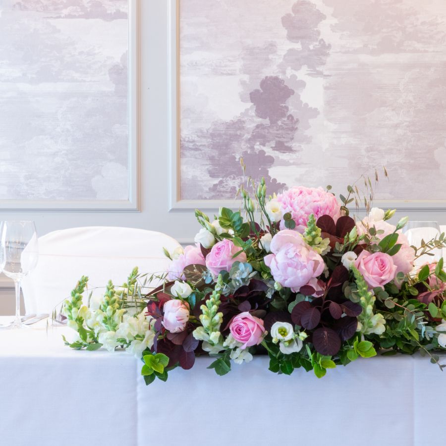 Wedding in Warwickshire | A bouquet of pink flowers on a table